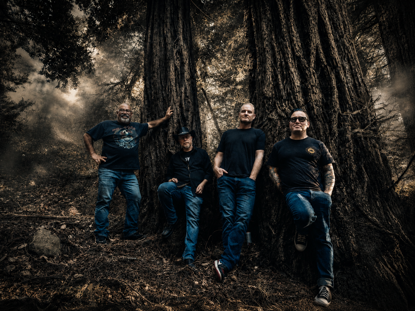 Petrified Charlie band members standing among large redwood trees